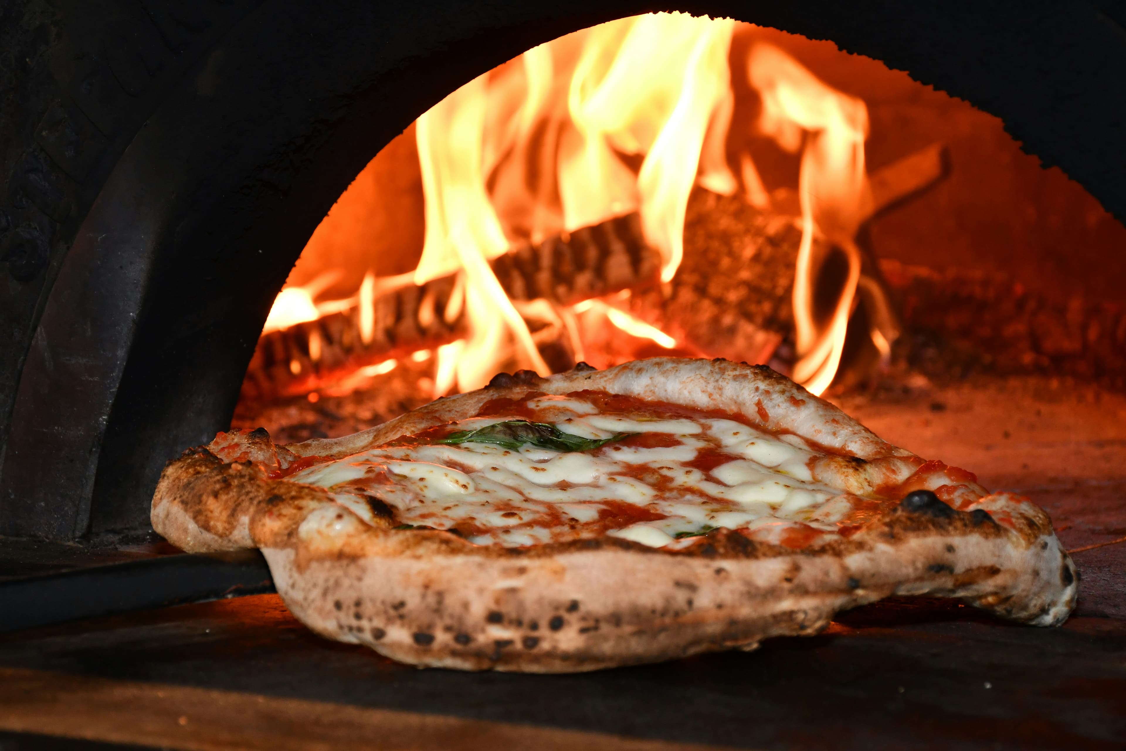 Wood-fired pizza in our traditional oven